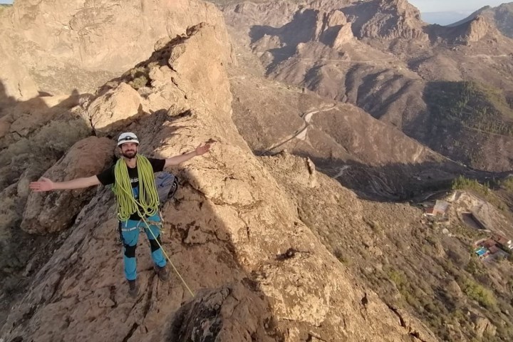 a person climbing a rocky mountain
