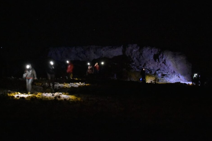 group of people night hiking