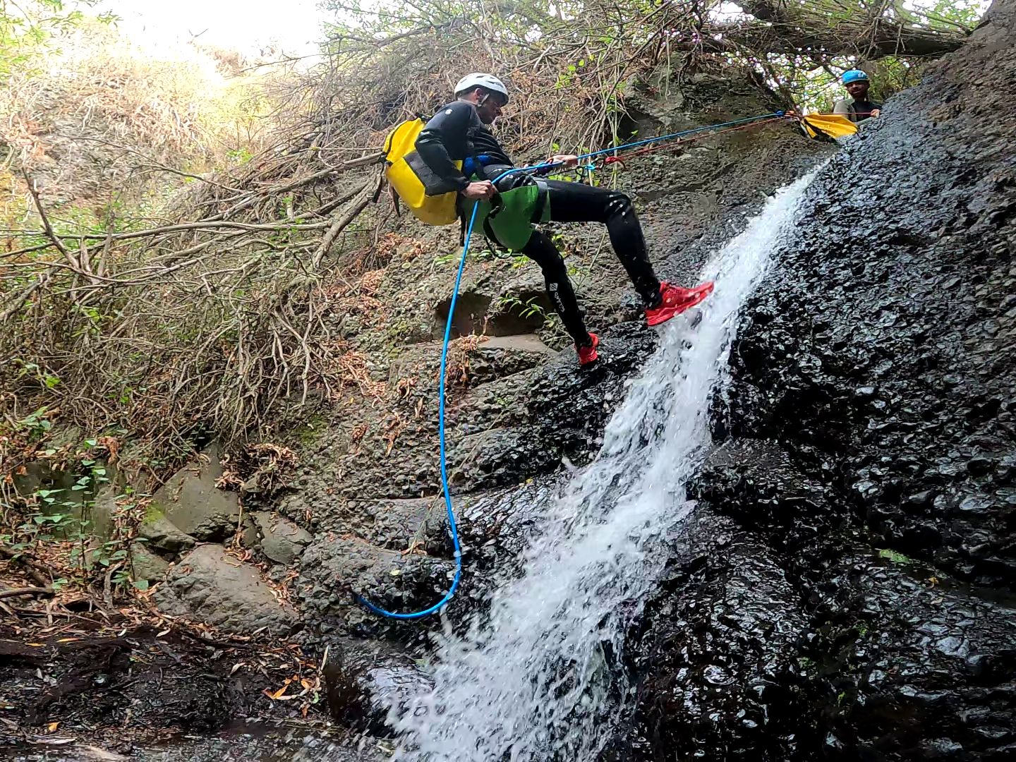 a group of people canyoning