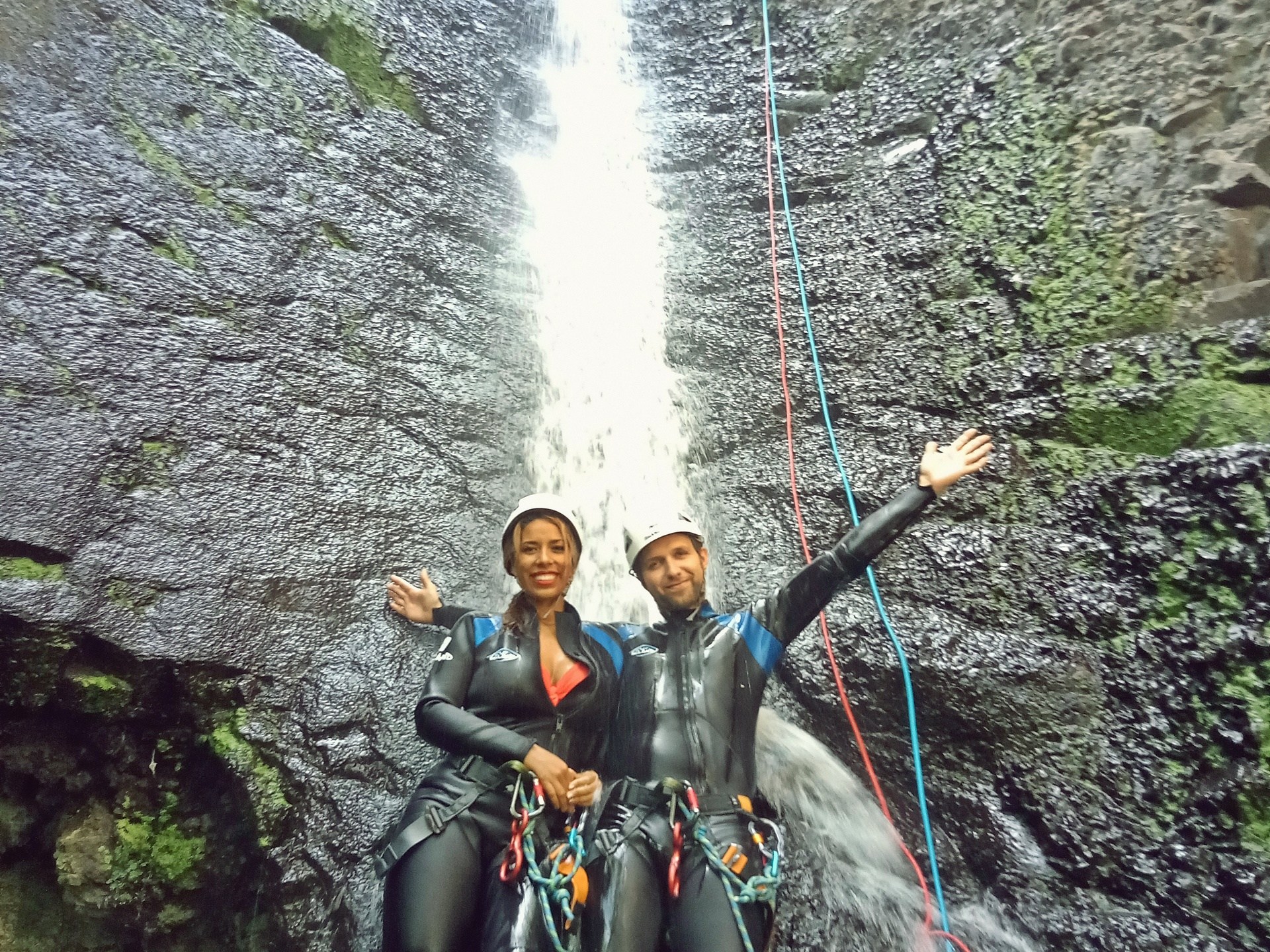 a group of people canyoning