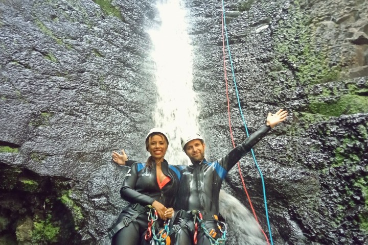 a group of people canyoning
