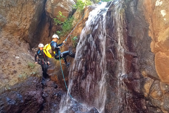 a group of people canyoning