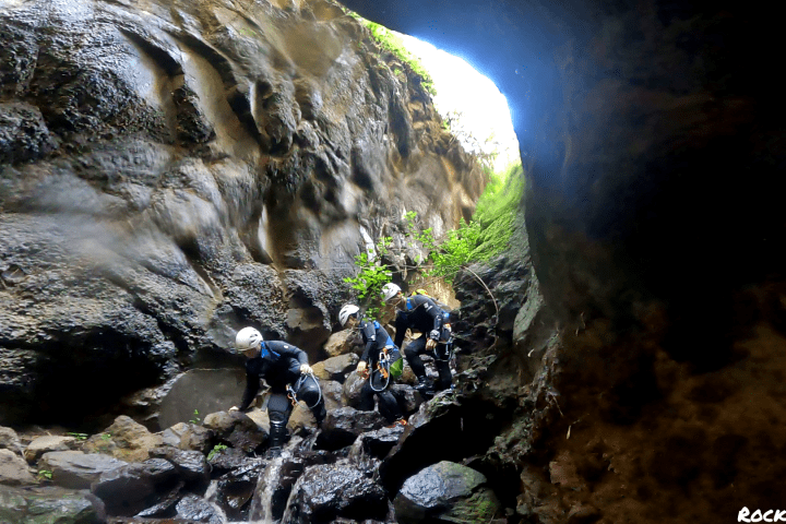 a group of people canyoning
