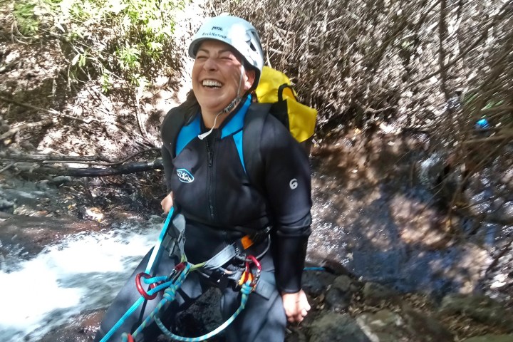 a person climbing a rocky mountain