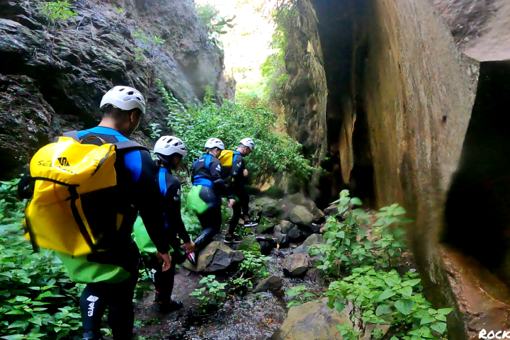 a group of people canyoning