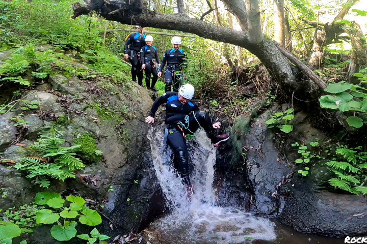 a group of people canyoning