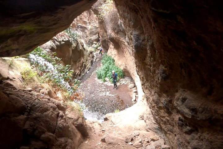 a group of people canyoning