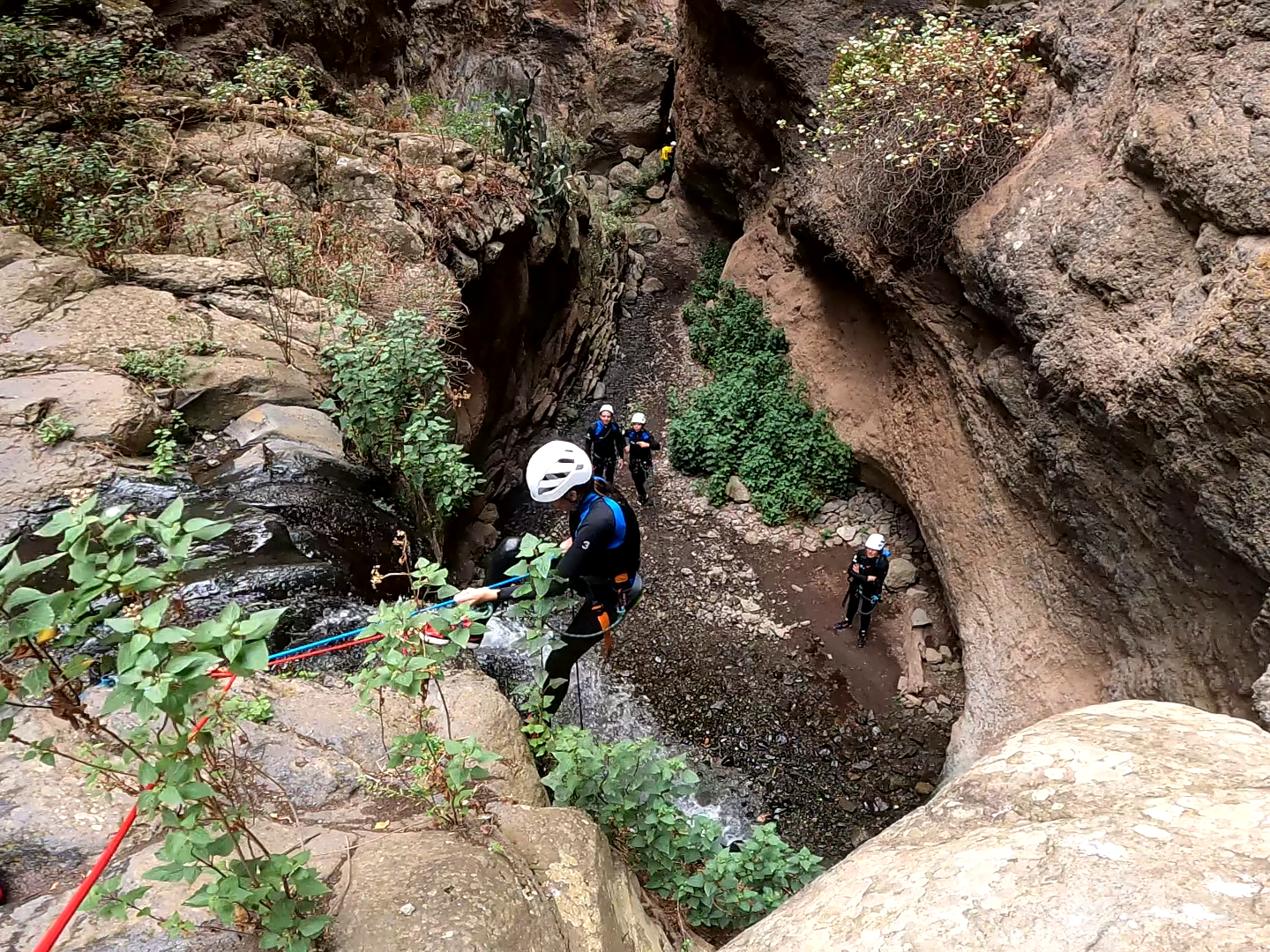 a group of people canyoning