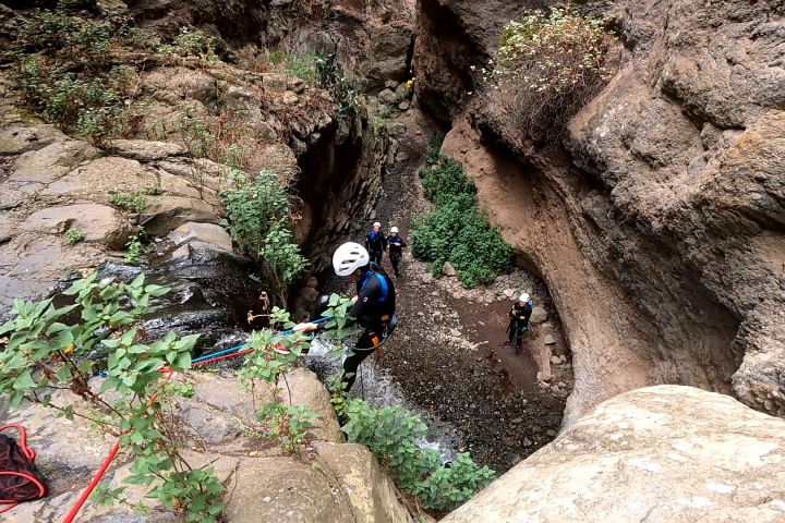 a group of people canyoning