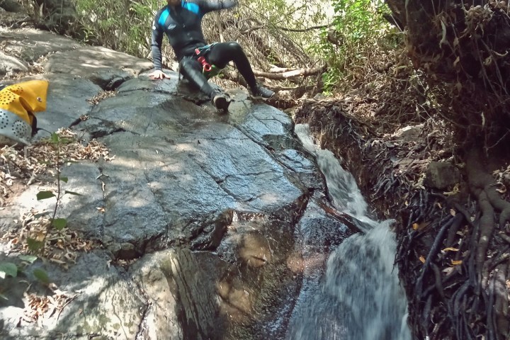 a group of people canyoning