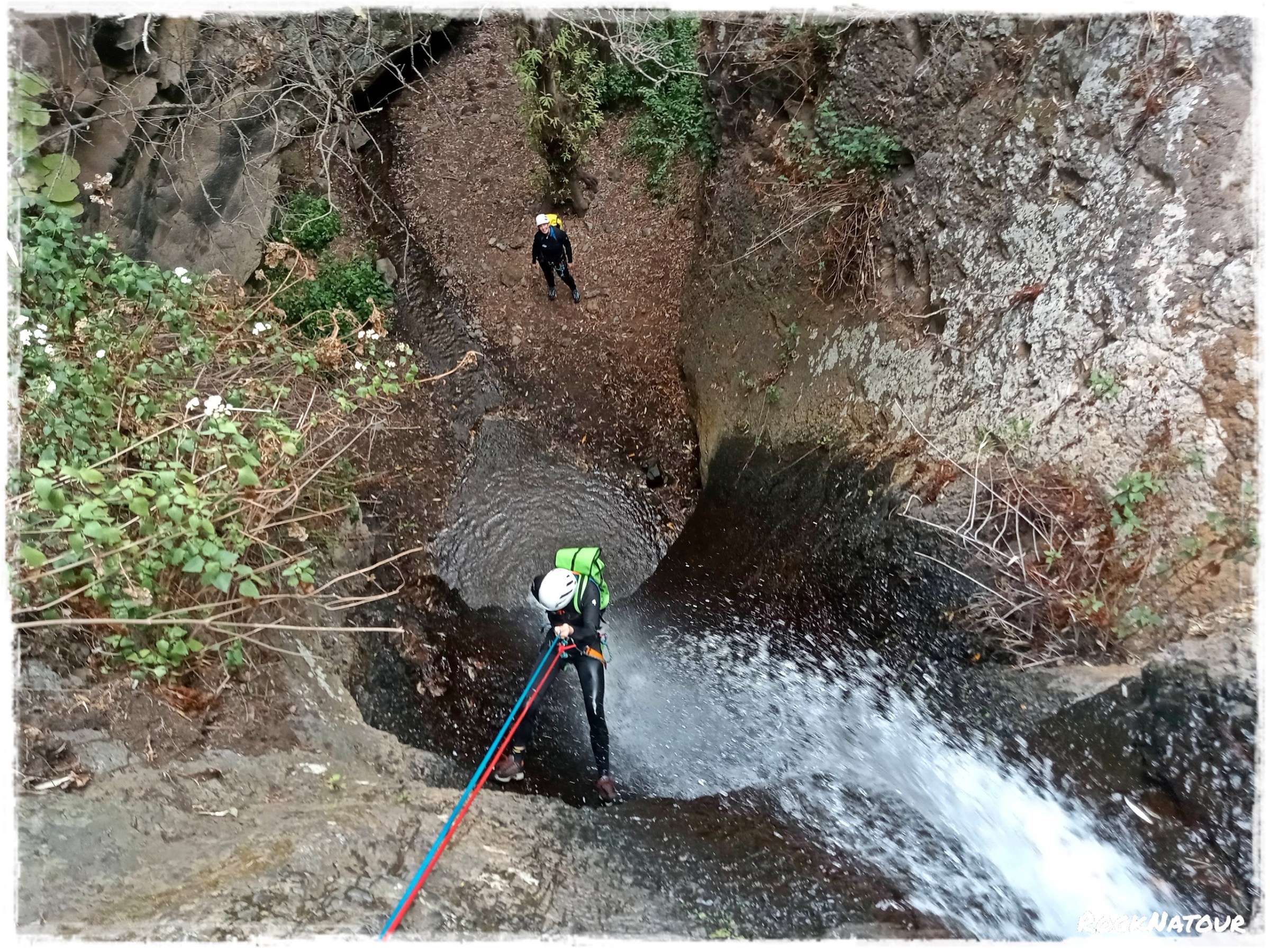 a group of people canyoning