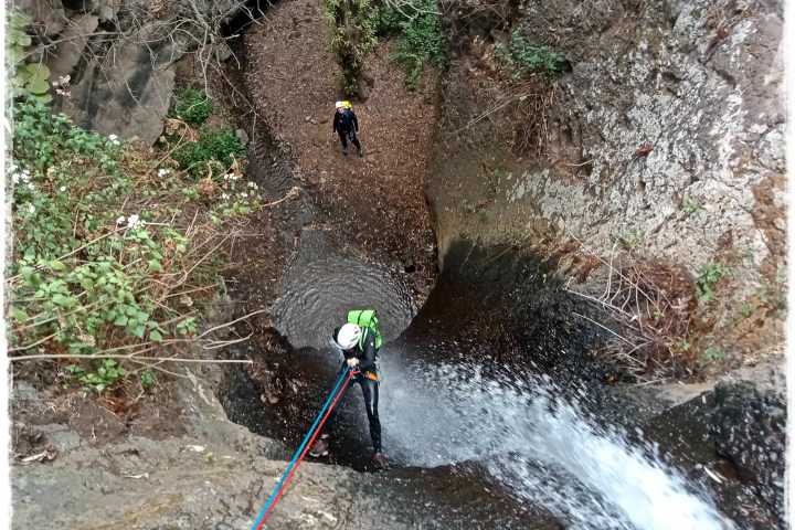 a group of people canyoning
