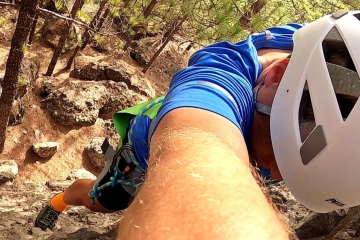 a person climbing a rocky mountain
