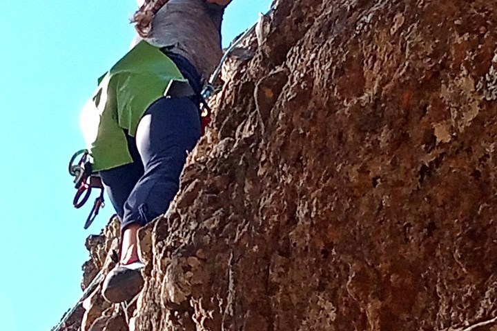 a person climbing a rocky mountain