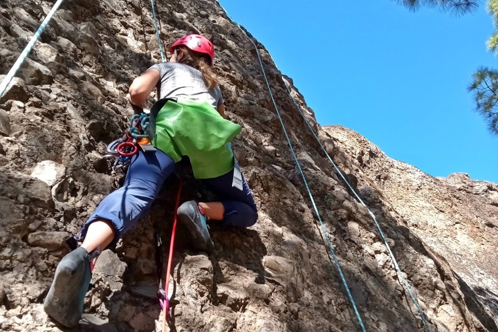 a person climbing a rocky mountain