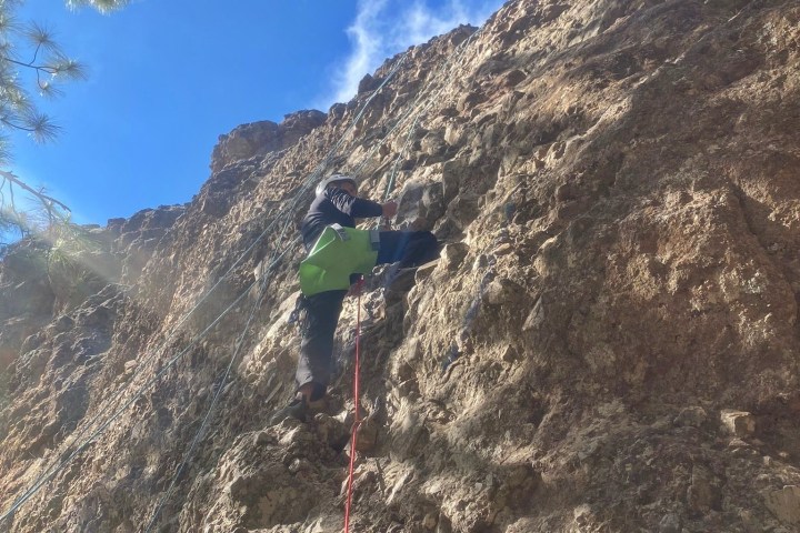 a person climbing a rocky mountain
