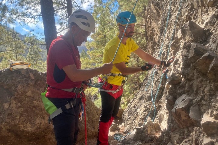 a person climbing a rocky mountain
