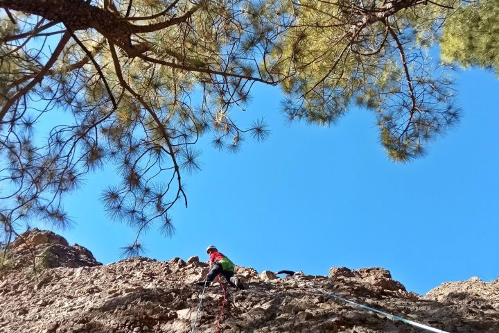 a person climbing a rocky mountain