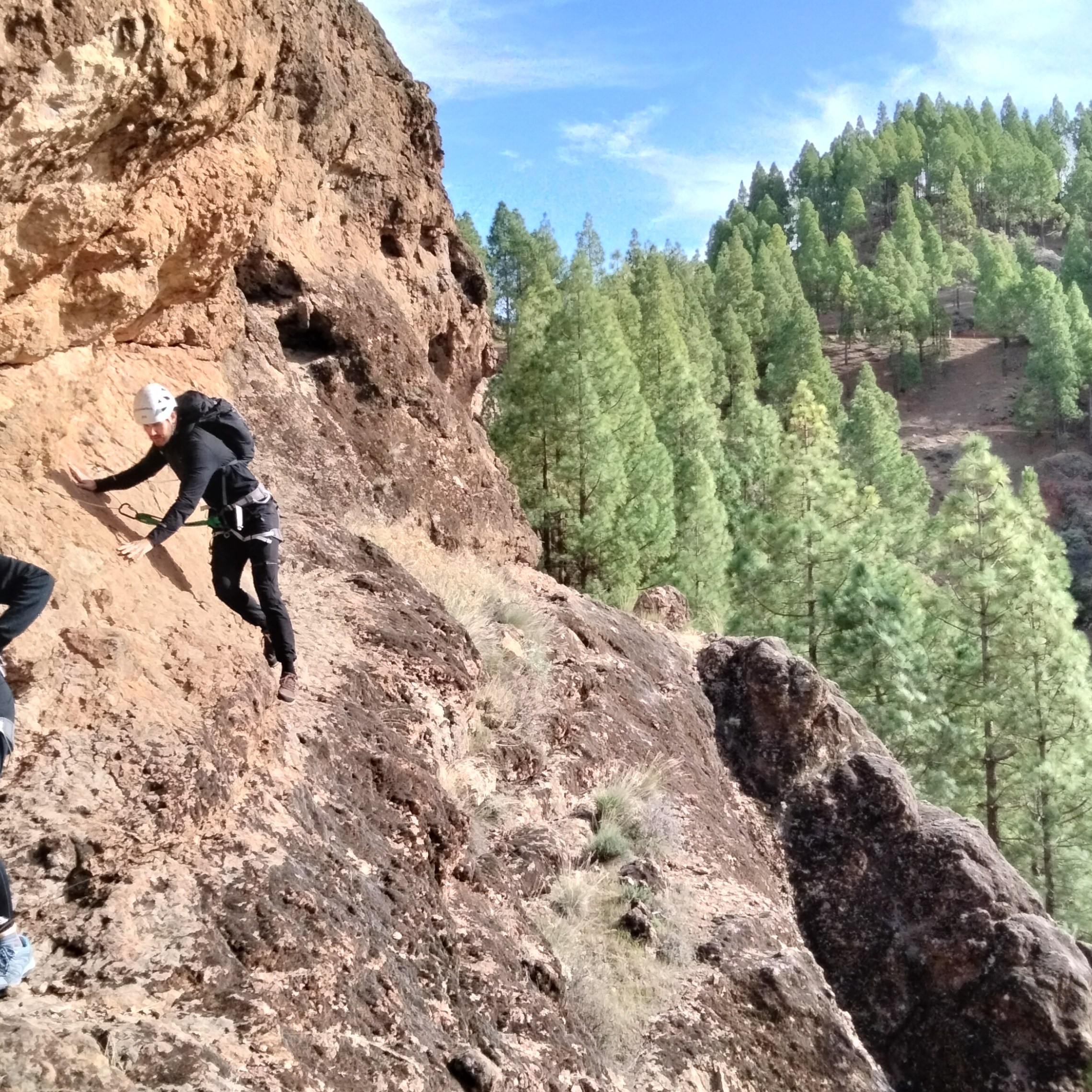 a man standing on a rocky hill