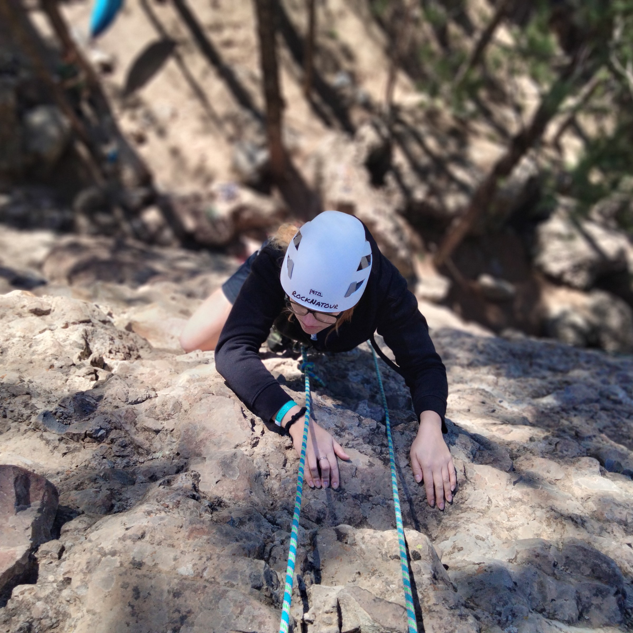 a man riding on top of a rock
