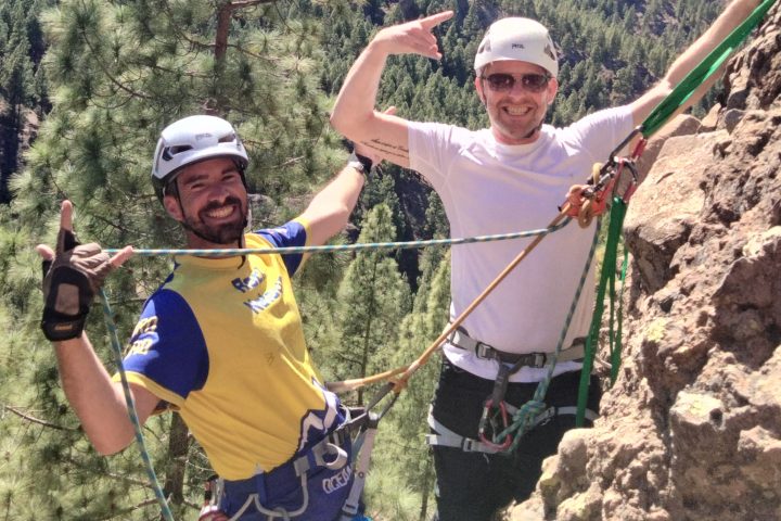 a group of people standing on top of a mountain