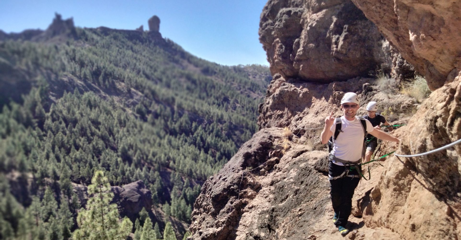 a man standing on a rocky hill