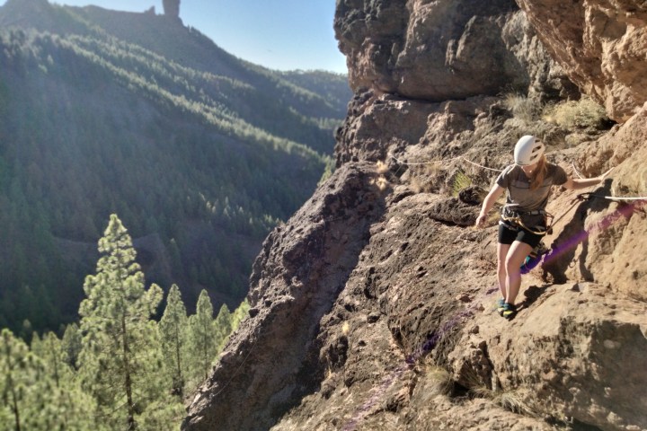 a man riding on top of a rocky mountain