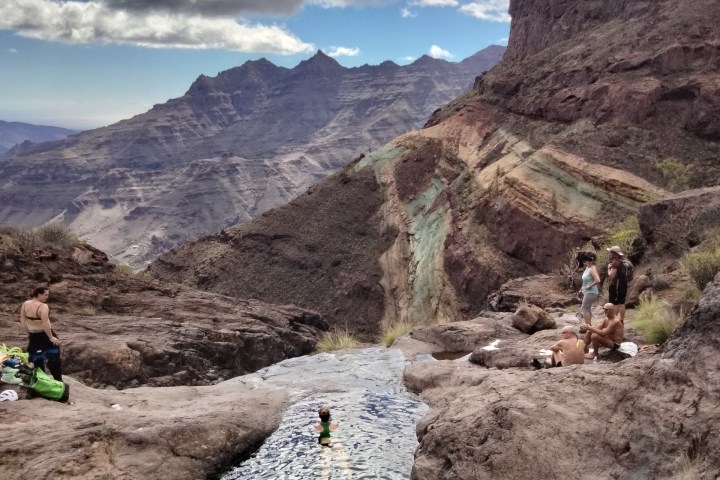 a group of people canyoning