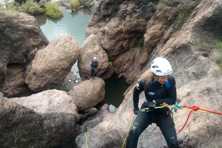 a person climbing a rocky mountain