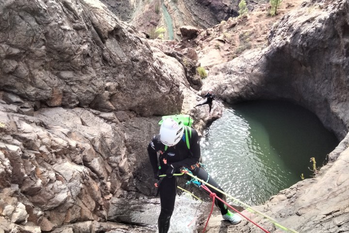 a person climbing a rocky mountain