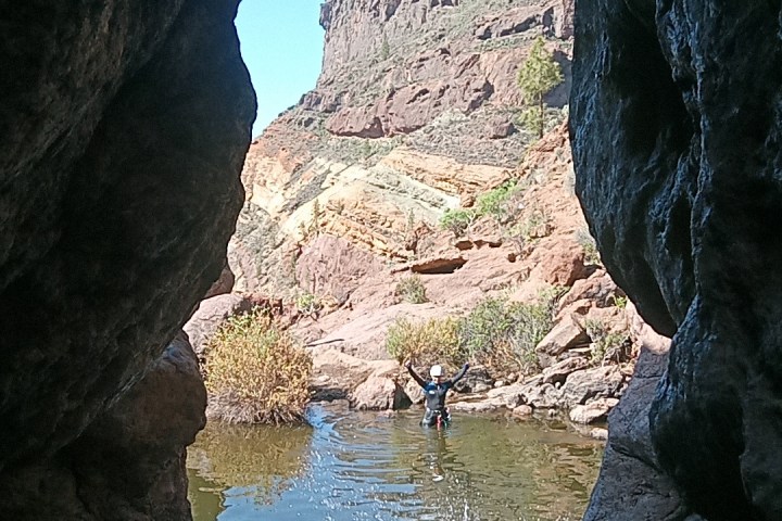 a group of people canyoning
