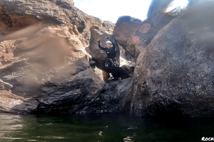 a group of people canyoning