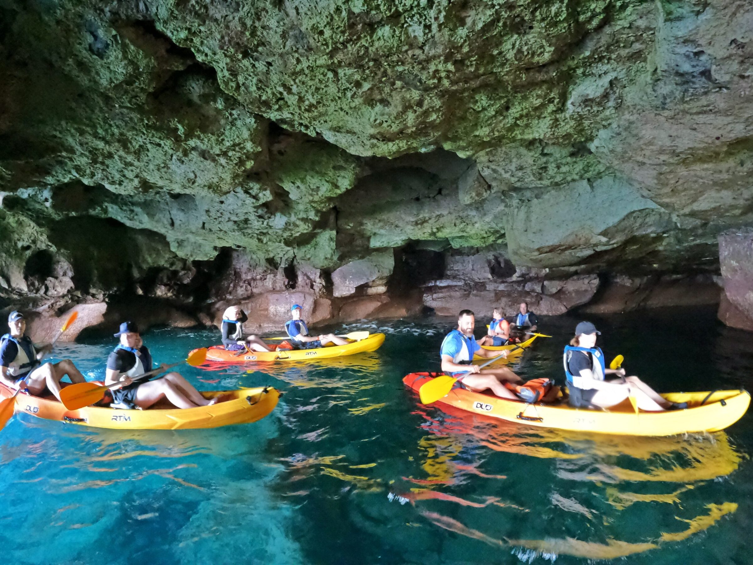 a group of people on a raft in a pool of water