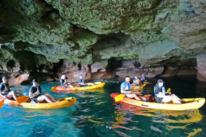 a group of people on a raft in a pool of water