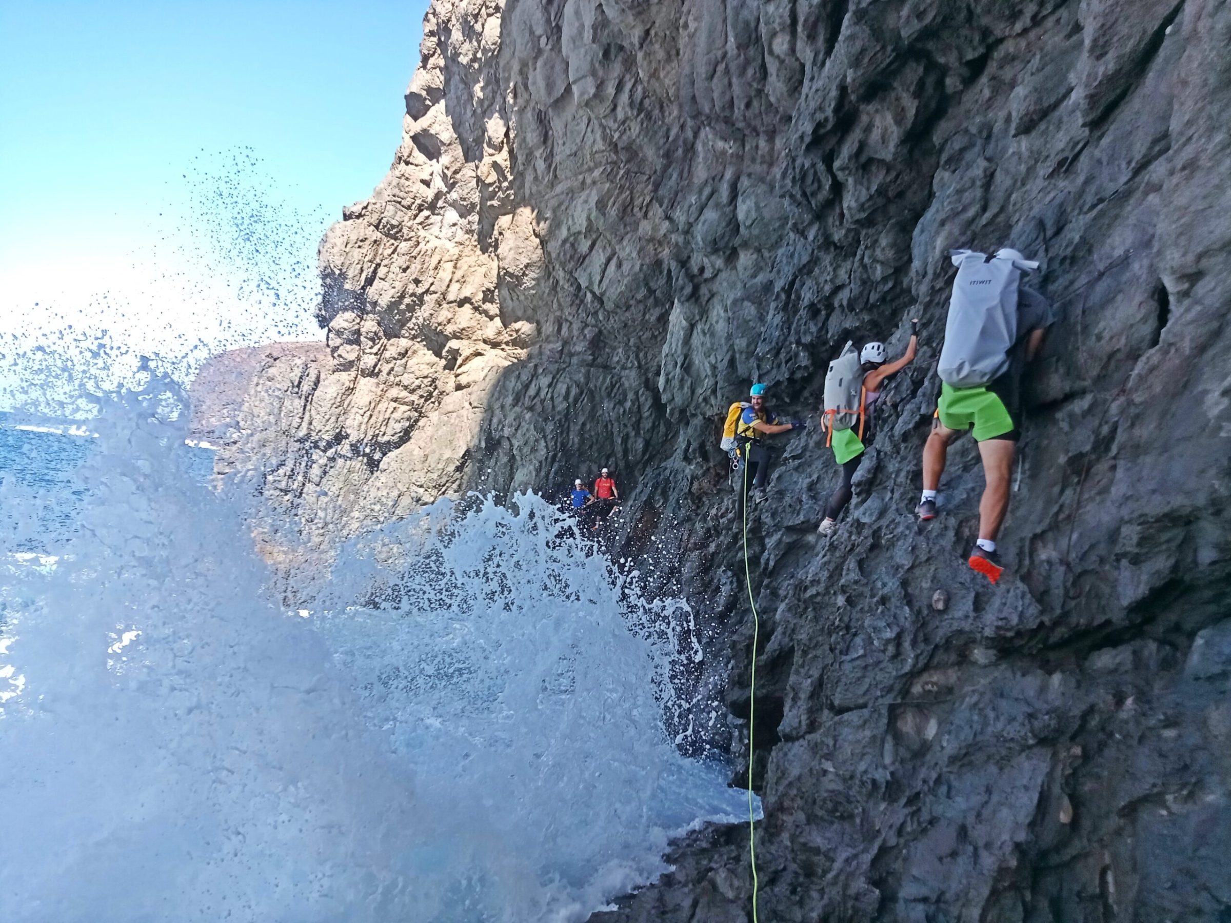 a man flying through the air on a rock