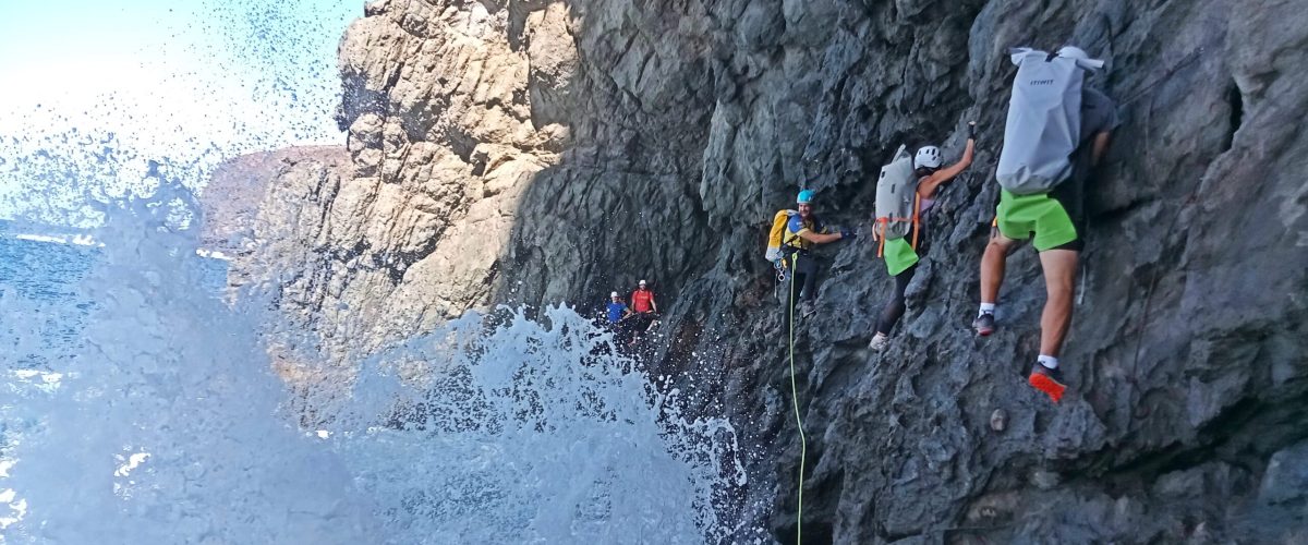 coasteering natural pools ocean cliff hidden beach gran canaria a man flying through the air on a rock