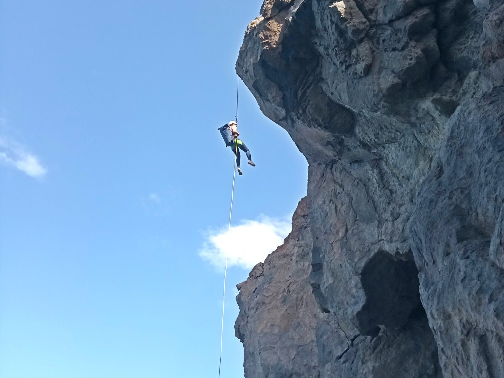 a person standing in front of a rocky mountain