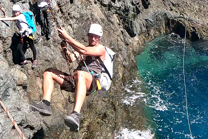 a man sitting on a rock