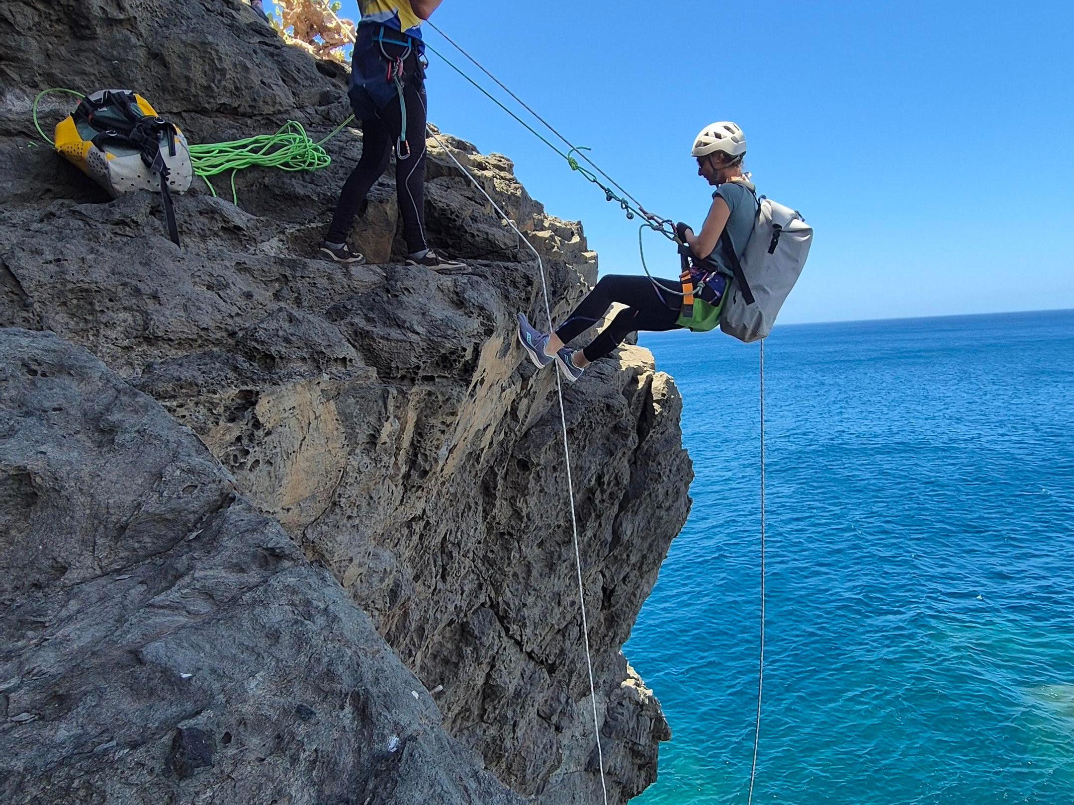a man doing a trick on a rocky hill