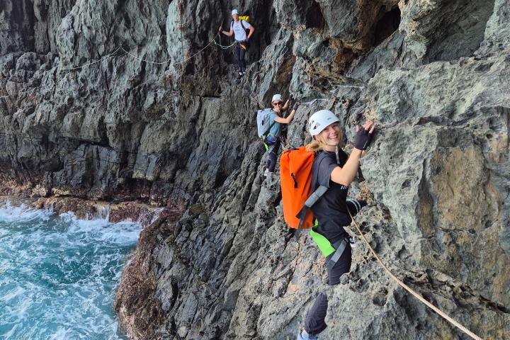 a man riding on top of a rock