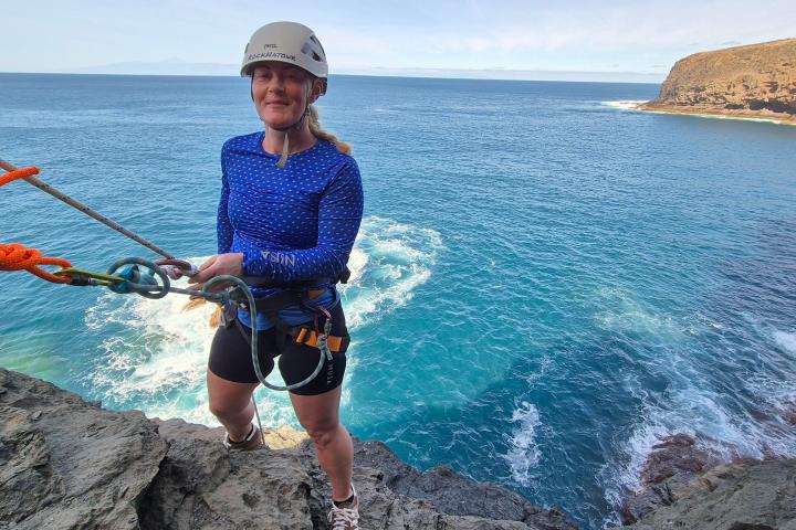 a person standing next to a body of water