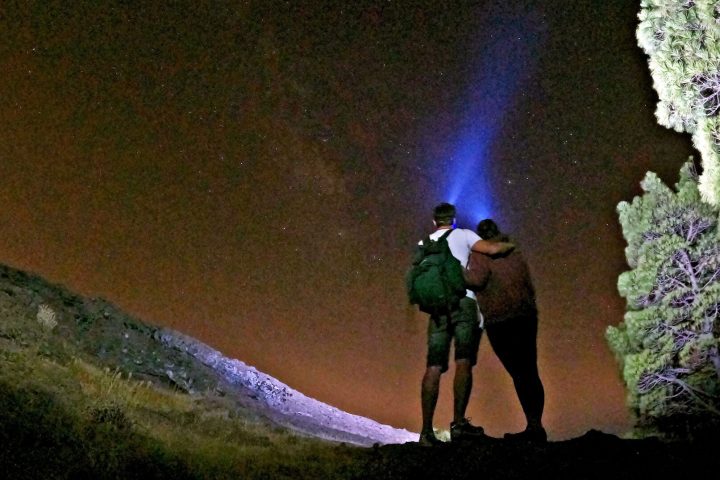 a man standing on top of a hill