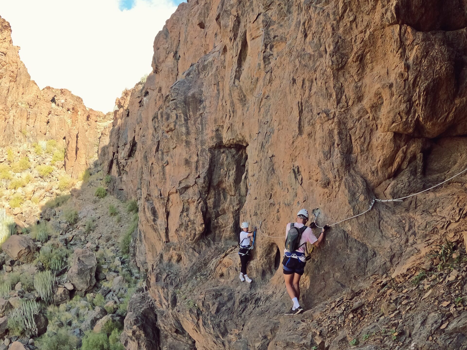 a man standing on a rocky hill