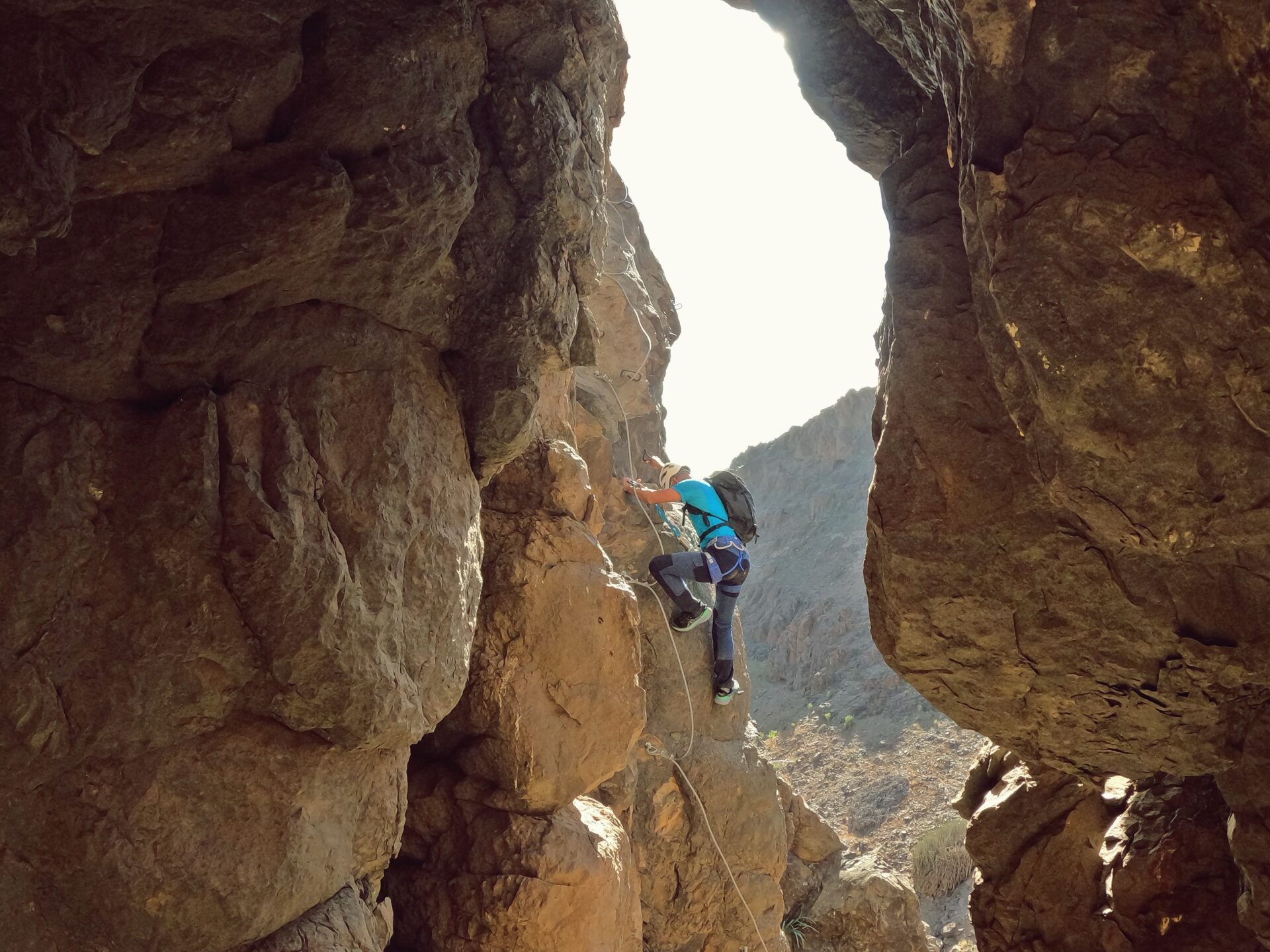 a man riding on the back of a cave