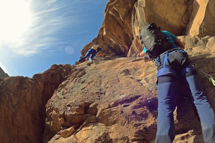 a man standing on a rocky hill