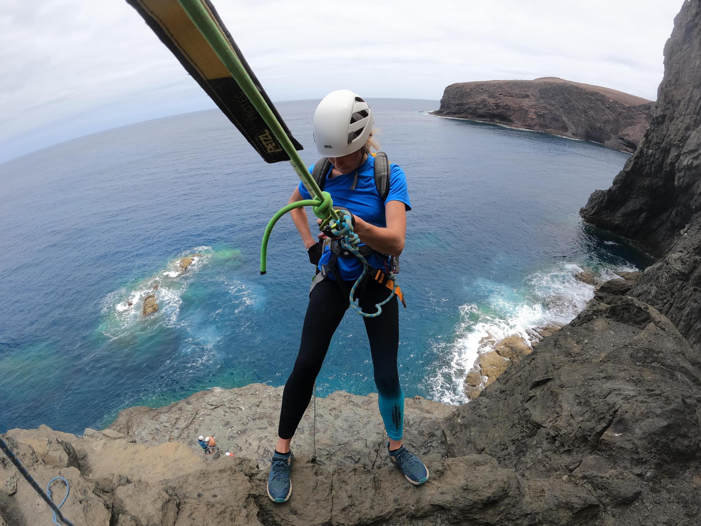 a man riding a board on a body of water