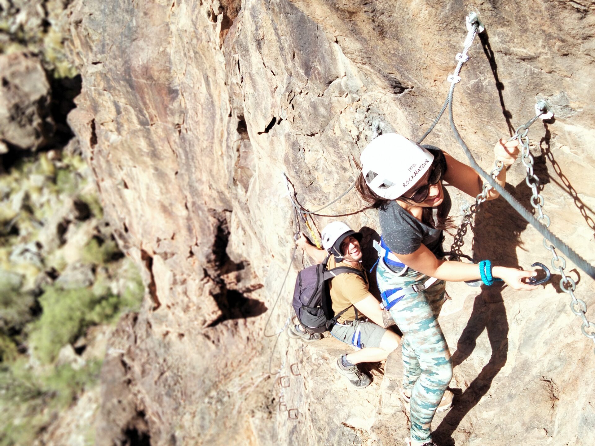 a man riding on top of a rock