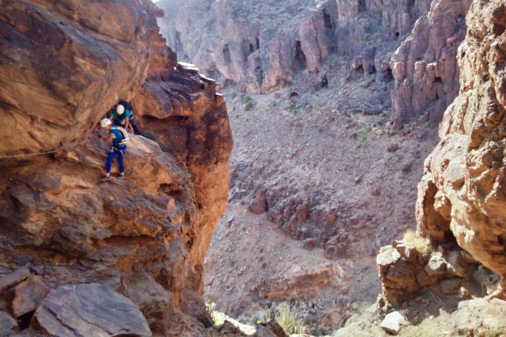 a canyon with a mountain in the background