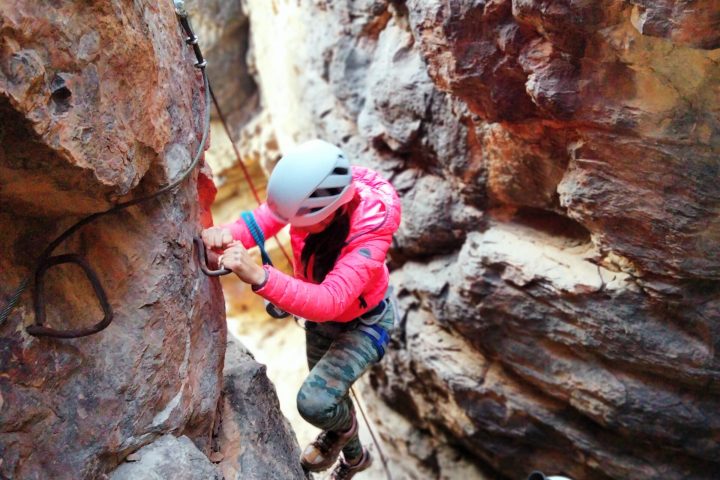 a person sitting on a rock