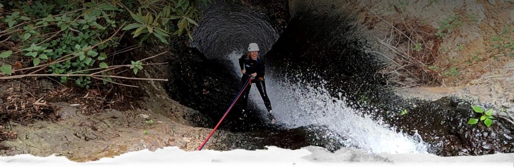 a man riding skis down a snow covered slope